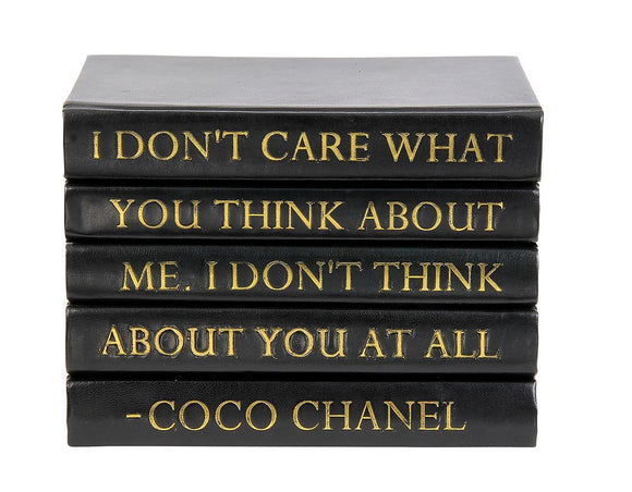 Stack of Black Leather Bound Books with Coco Chanel Quote 