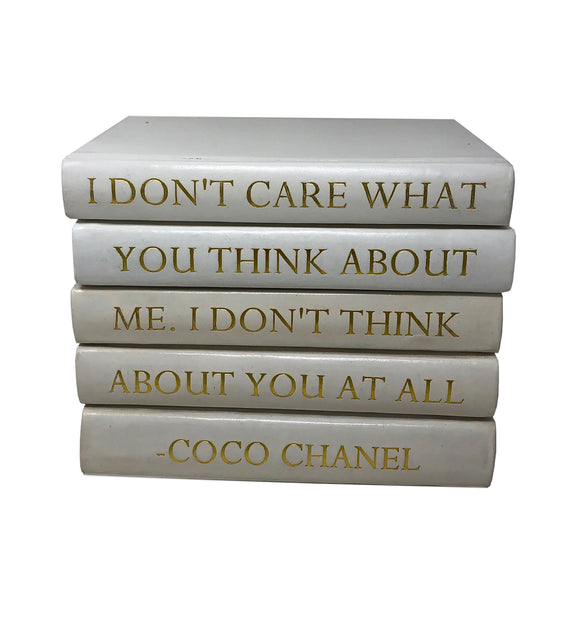 Stack of White Leather Bound Books with Coco Chanel Quote I Don't